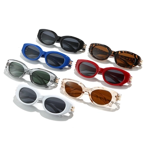 Chic 2025 retro oval cat-eye sunglasses set in various colors with metallic hinge details