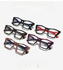 Detail view of stylish multi-color geometric cat-eye frames with unique marble patterns
