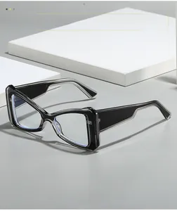 Detail view of cat-eye glasses with transparent layered frames and blue light blocking lenses