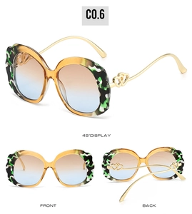 Detailed views of oval sunglasses with gold heart temples and colorful marble frames