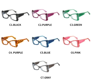 Flat lay display of seven colorful cat-eye eyewear frames in various transparent finishes