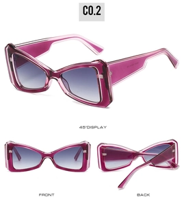 Detail view of purple cat-eye sunglasses with gradient lenses and metal hinges