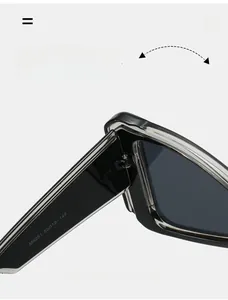 Detailed close-up of the durable metal hinge structure on retro oversized sunglasses