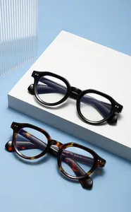 Detail of retro round frames with specs 3969 and decorative metal rivets on the temples