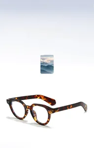 Detailed view of tortoiseshell round frames with vintage metal rivet hinges and thick arms