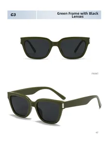 Détail de lunettes de soleil carrées vertes avec verres gris et accents argentés