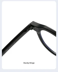 Detailed macro view showing the sturdy metal hinge and bridge of black acetate sunglasses