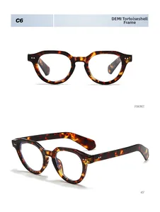 Detail view of round tortoiseshell sunglasses with metal rivets in front and 45 degree angle