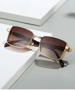 Detail of retro gold metal frame sunglasses with gradient lenses and side textures