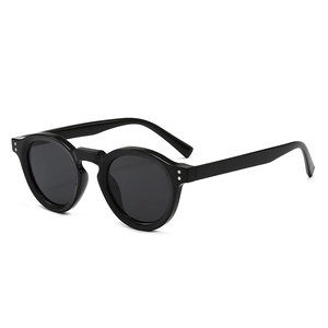 Classic black vintage round sunglasses with thick frames shown from a 45-degree angle