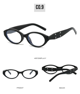 Detail view of black cat-eye sunglasses with signature four-stitch temple design