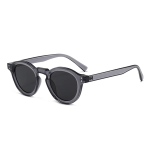 Classic retro round sunglasses with translucent grey frame and silver metal rivets