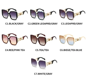 Detail view of colorful geometric sunglasses with gold metal hollowed temple design