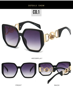 Detail of stylish oversized sunglasses featuring golden hollow geometric temples and logo