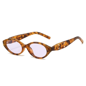 Retro oval cat eye sunglasses with tortoiseshell frame and purple lenses for UV protection