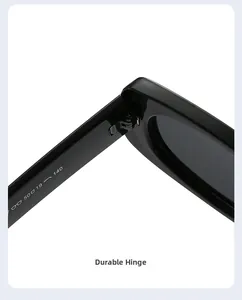 Macro shot of reinforced metal hinges and engraved frame specs on black sunglasses