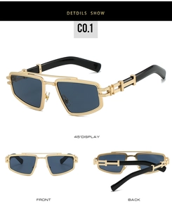 Détails des lunettes de soleil en métal doré avec branches noires et monture géométrique
