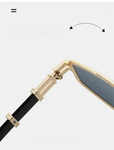 Détail de la charnière en métal doré sur des lunettes de soleil punk vintage avec branches noires