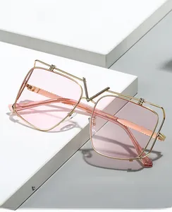 Detail of luxury gold metal square frame glasses with anti-blue light pink lenses