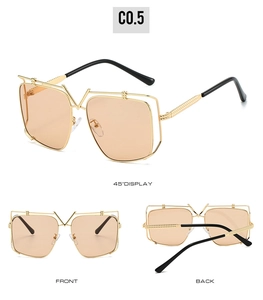 Detail of luxury metal sunglasses with V-shape bridge and orange tinted lenses