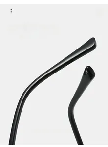 Macro shot of curved glossy black sunglass arms for comfortable ergonomic wearing