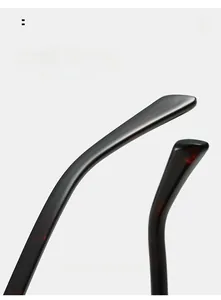 Detail view of tortoiseshell patterned curved temple legs on premium PC metal sunglasses