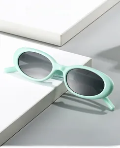Detail of 2025 oval sunglasses in mint green frame with protective grey lenses