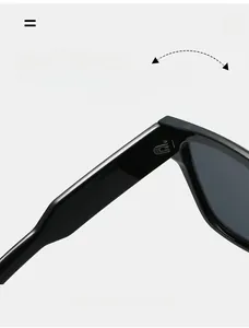 Close-up of durable metal hinge on vintage square sunglasses with black frame finish