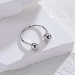 Minimalist silver horseshoe circular barbell ring with screw-on beads on stone base