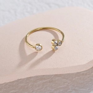 Minimalist gold-plated stainless steel open ring featuring sparkling zirconia stones