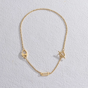 Gold stainless steel necklace featuring a geometric pig nose design and toggle clasp