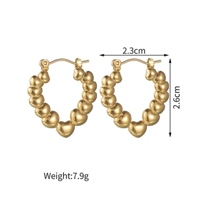 Détails de boucles d'oreilles créoles cœur dorées avec taille 2,3x2,6cm et poids 7,9g