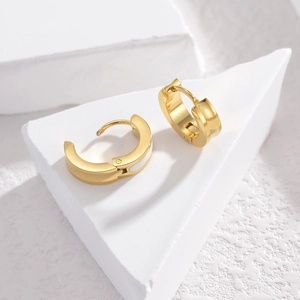 Minimalist gold-plated stainless steel hoop earrings with white enamel finish on white stone