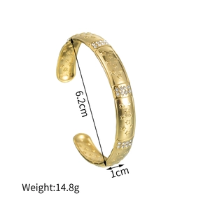Engraved gold star cuff bracelet with sparkling crystal inlay for a modern luxury look