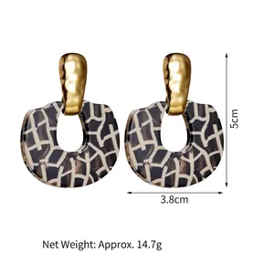 Vintage geometric leopard print earrings with gold hammered metal and horseshoe design