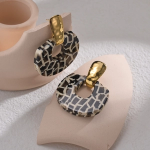 Modern geometric leopard print earrings in gold and black stainless steel design
