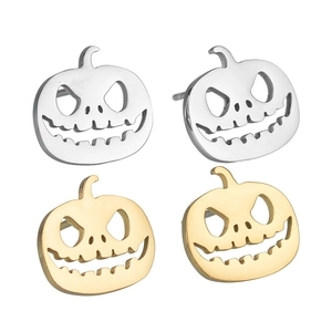 Detail of Halloween pumpkin stud earrings in gold and silver finish with hollow design