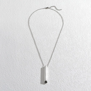 Silver cylinder whistle pendant necklace with adjustable chain on white background
