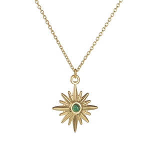 Gold eight-pointed star pendant necklace with round emerald green stone on white background