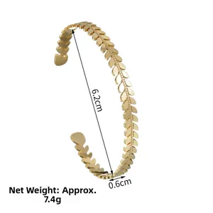 Detailed view of golden leaf-shaped bangle with measurements 6.2cm inner diameter