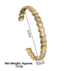 Detail view of gold stainless steel bangle with dimensions 6.3cm diameter and 0.8cm width