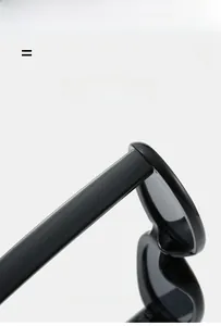 Detail of glossy black oval sunglasses hinge showing ultra-light and elastic material