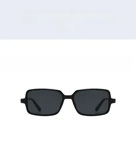 Front view of black rectangular sunglasses with dark lenses and stylish rivets