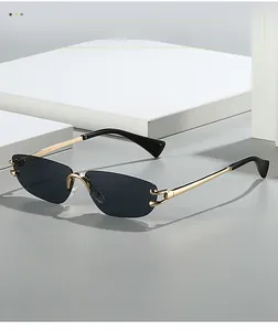 Detail view of rimless sunglasses with gradient lenses and gold-tone metal temple hinges