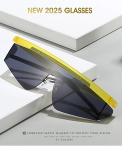 Detail showing oversized translucent yellow frame and dark grey lens of trendy outdoor sunglasses