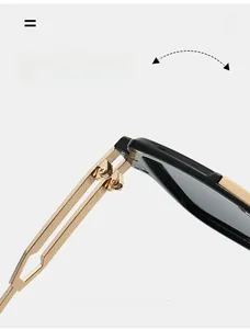 Detail view of durable gold metal hinge on large square black frame sunglasses