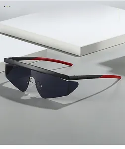 Close-up of futuristic rimless sport sunglasses with black and red contrasting temples
