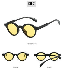 Detail view of vintage round sunglasses with black frames and yellow transparent lenses