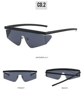 Detailed views of futuristic oversized gray sunglasses with geometric cut-edge lenses