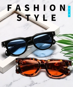 Detail of square vintage sunglasses in black-blue and tortoise-orange finishes